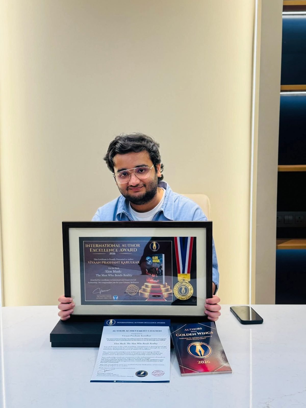Vivaan Karulkar receiving the International Author Excellence Award
